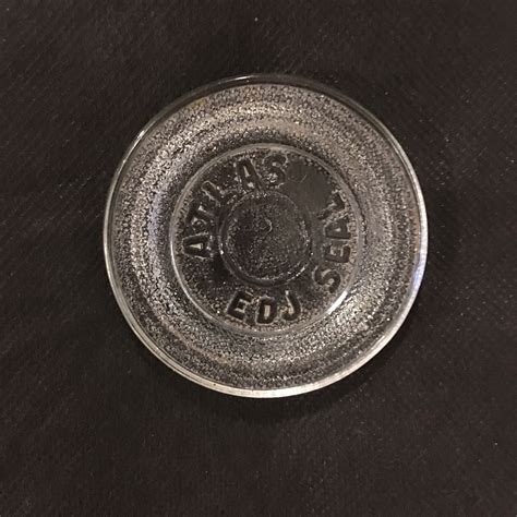 This vintage clear glass seal from Atlas EDJ is a must-have for any collector of modern (1900-now) bottle caps. . Atlas edj seal